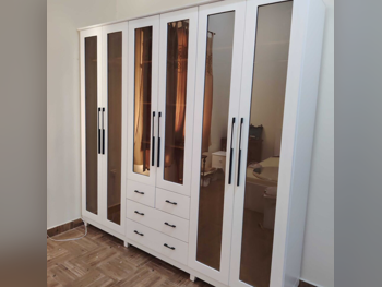 خزائن ودواليب الملابس والزينة - دوحة فيرنيتشر - خزائن - أبيض