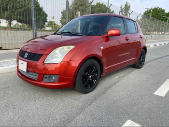 Suzuki  Swift  2009  Automatic  100,500 Km  4 Cylinder  Hatchback  Orange