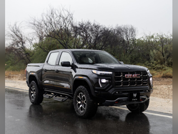 جي ام سي  كانيون  اي تي 4 اكس  2025  اوتوماتيك  200 كم  4 سلندر  دفع رباعي  بيكب  أسود  تحت الضمان