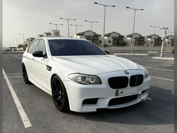 بي ام دبليو  الفئة - ام  5  2013  اوتوماتيك  112,500 كم  8 سلندر  دفع خلفي  سيدان  أبيض