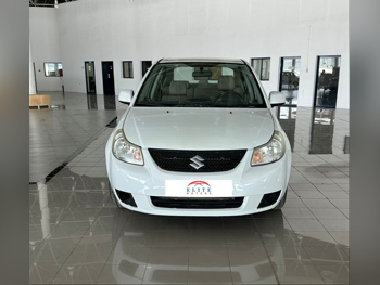 Suzuki  SX4  2014  Automatic  170,000 Km  4 Cylinder  Front Wheel Drive (FWD)  Sedan  White