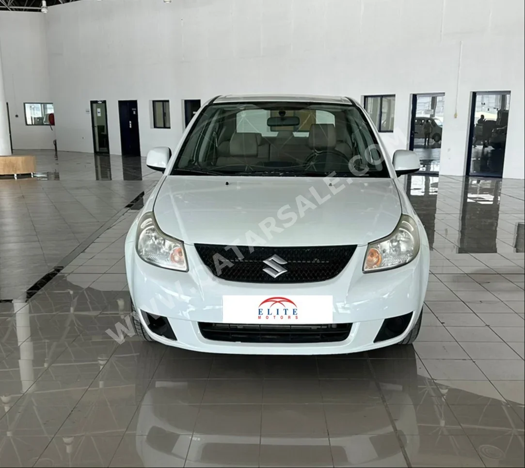Suzuki  SX4  2014  Automatic  170,000 Km  4 Cylinder  Front Wheel Drive (FWD)  Sedan  White