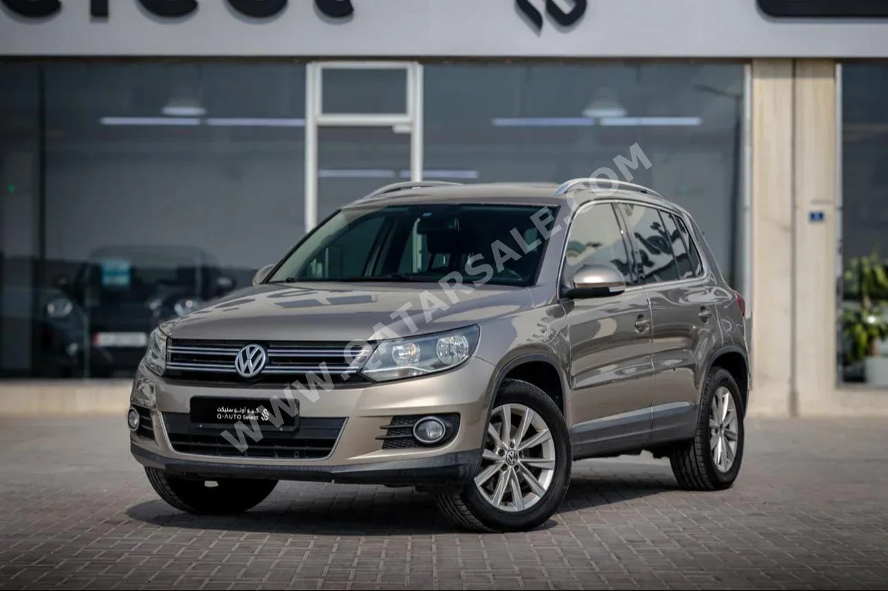 Volkswagen  Tiguan  2.0 TSI  2014  Automatic  134,000 Km  4 Cylinder  Front Wheel Drive (FWD)  SUV  Beige