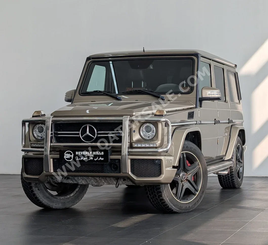 مرسيدس - بنز جي - كلاس 63 اي ام جي 2014 اوتوماتيك 137,510 كم 8 سلندر دفع رباعي اس يو في ذهبي