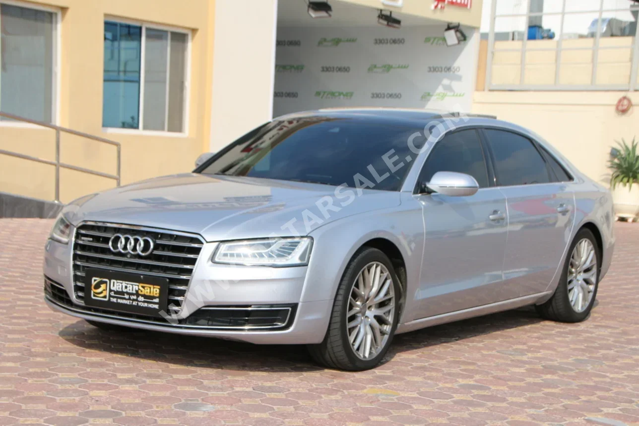 اودي  أي 8  50 TFSI  2016  اوتوماتيك  129,000 كم  8 سلندر  دفع خلفي  سيدان  فضي