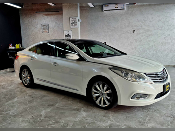 هيونداي  ازيرا  2014  اوتوماتيك  60,000 كم  6 سلندر  سحب امامي  سيدان  أبيض  تحت الضمان