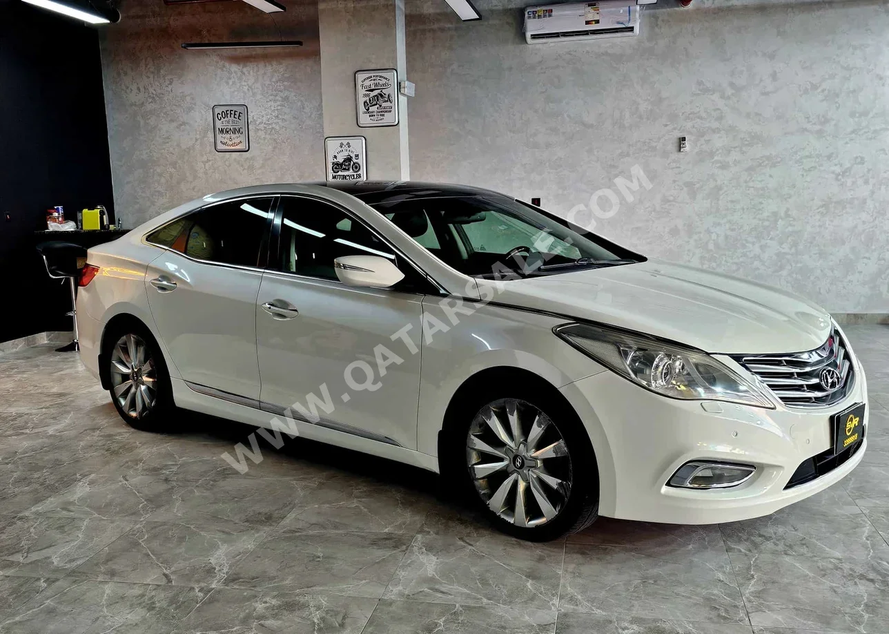 Hyundai  Azera  2014  Automatic  60,000 Km  6 Cylinder  Front Wheel Drive (FWD)  Sedan  White  With Warranty