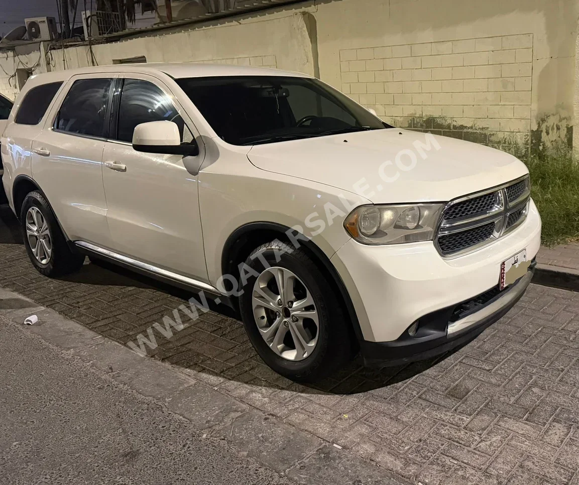 دودج  دورانغو  2013  اوتوماتيك  200,000 كم  4 سلندر  اس يو في  أبيض