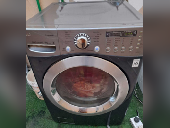 غسالة ملابس & الكل في واحد ال جي \  غسالة تحميل أمامي  اللون الرمادي