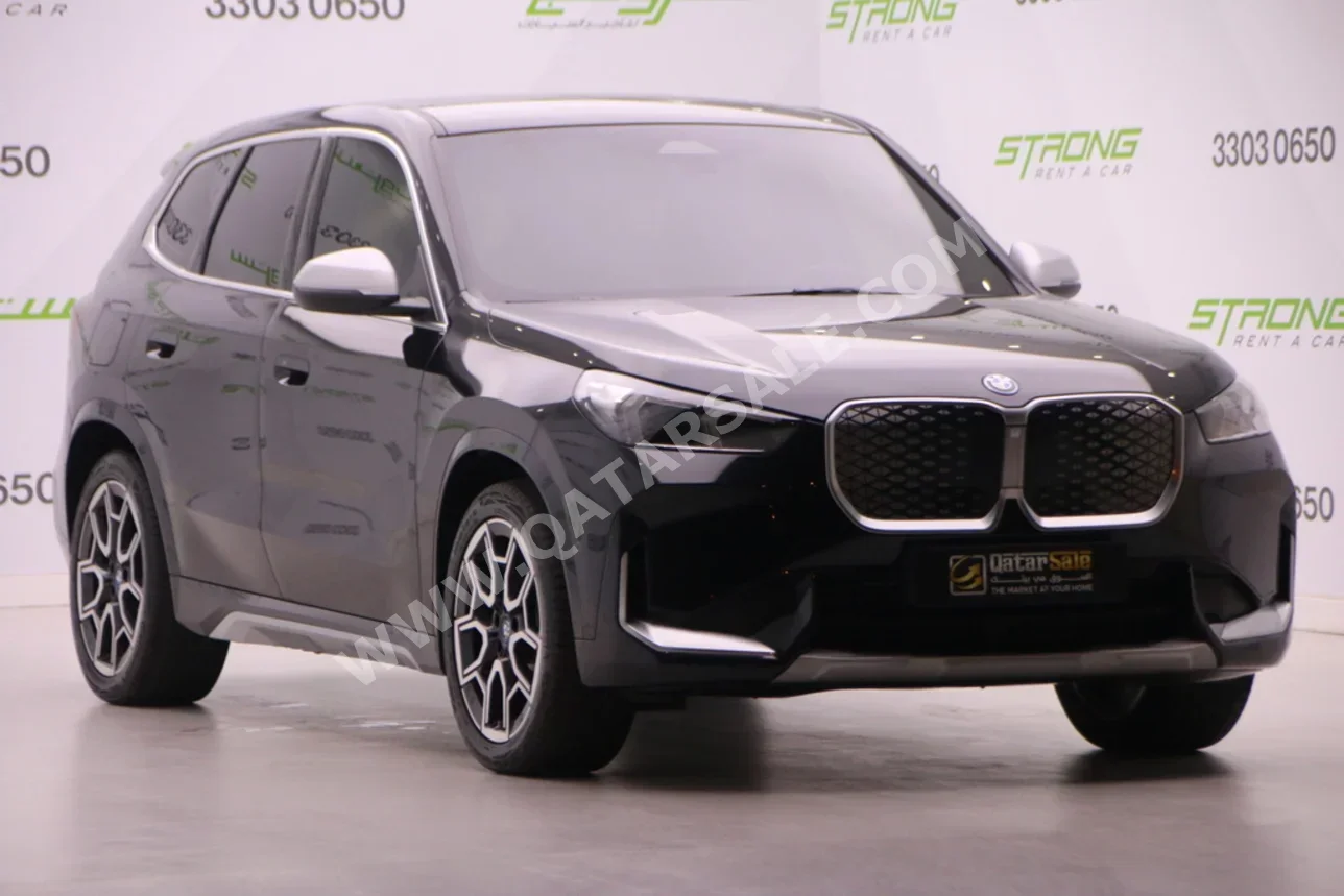 BMW  IX  1  2024  Automatic  4,000 Km  0 Cylinder  Four Wheel Drive (4WD)  SUV  Black  With Warranty