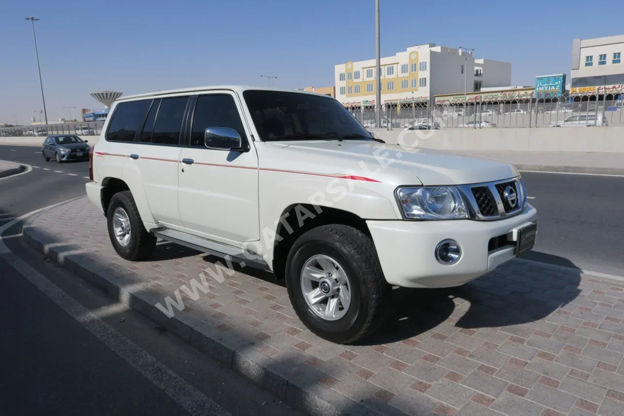 Nissan  Patrol  Safari  2023  Manual  62,000 Km  6 Cylinder  Four Wheel Drive (4WD)  SUV  White  With Warranty