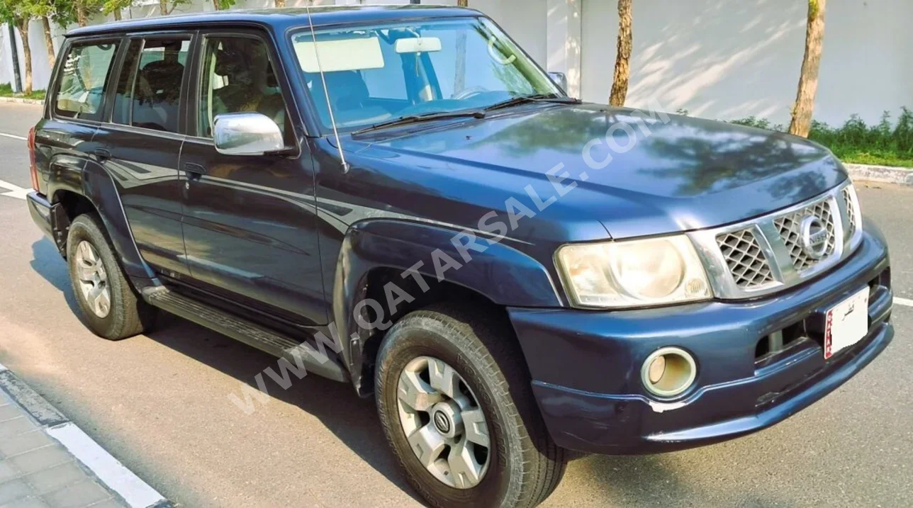 Nissan  Patrol  Super Safari  2005  Automatic  310,000 Km  6 Cylinder  Four Wheel Drive (4WD)  SUV  Dark Blue