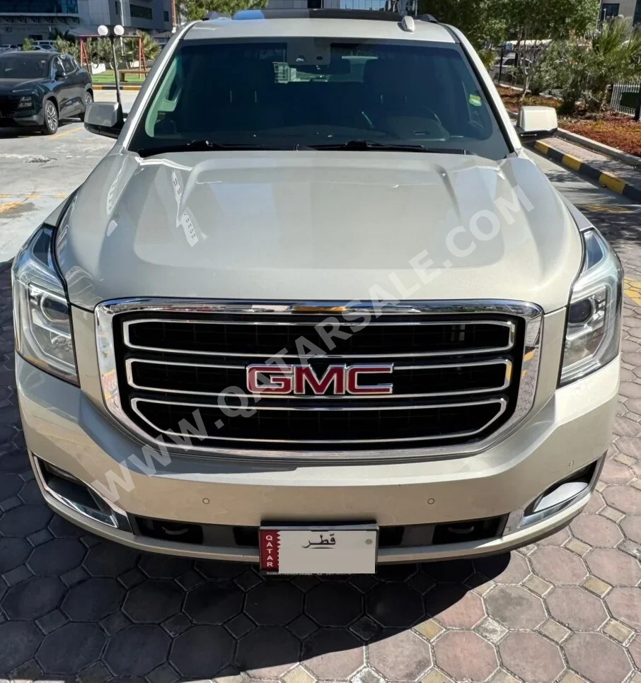 GMC  Yukon  SLT  2015  Automatic  126,800 Km  8 Cylinder  Four Wheel Drive (4WD)  SUV  Gold