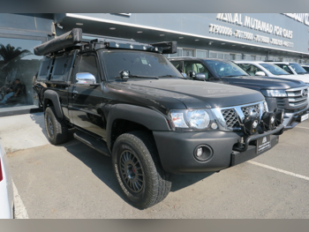 نيسان  باترول  بيك اب  2014  عادي  124,000 كم  6 سلندر  دفع رباعي  بيكب  أسود