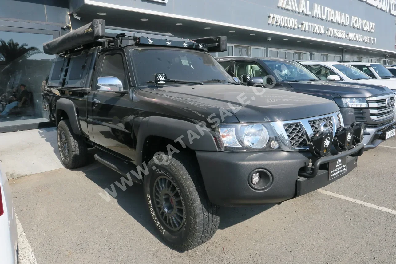Nissan  Patrol  Pickup  2014  Manual  124,000 Km  6 Cylinder  Four Wheel Drive (4WD)  Pick Up  Black