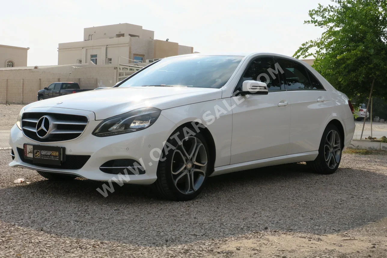 مرسيدس - بنز اي - كلاس 200 2015 اوتوماتيك 66,000 كم 4 سلندر دفع خلفي سيدان أبيض