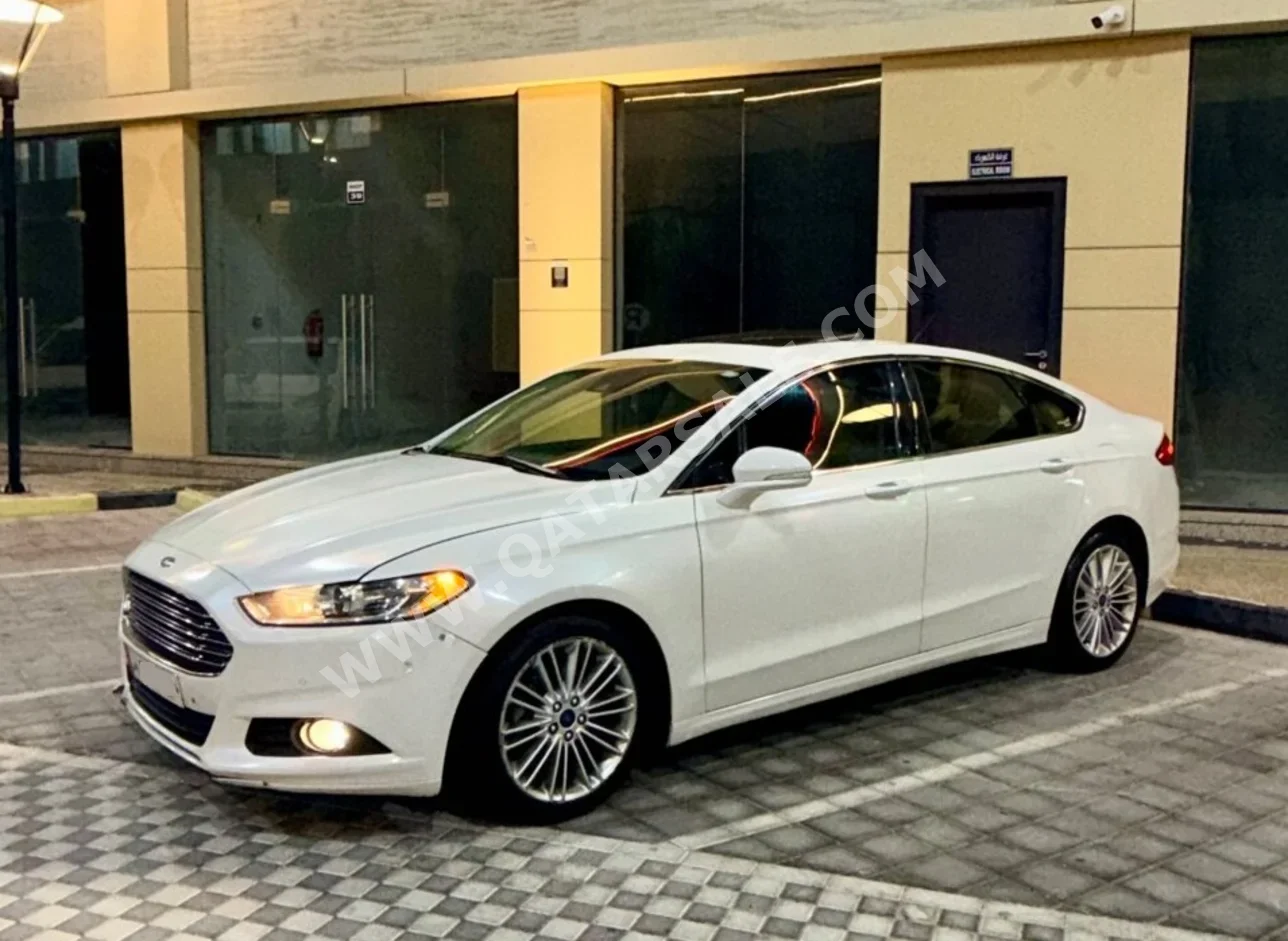 فورد فيوشن تيتانيوم 2016 اوتوماتيك 266,000 كم 4 سلندر دفع خلفي سيدان أبيض لؤلؤي