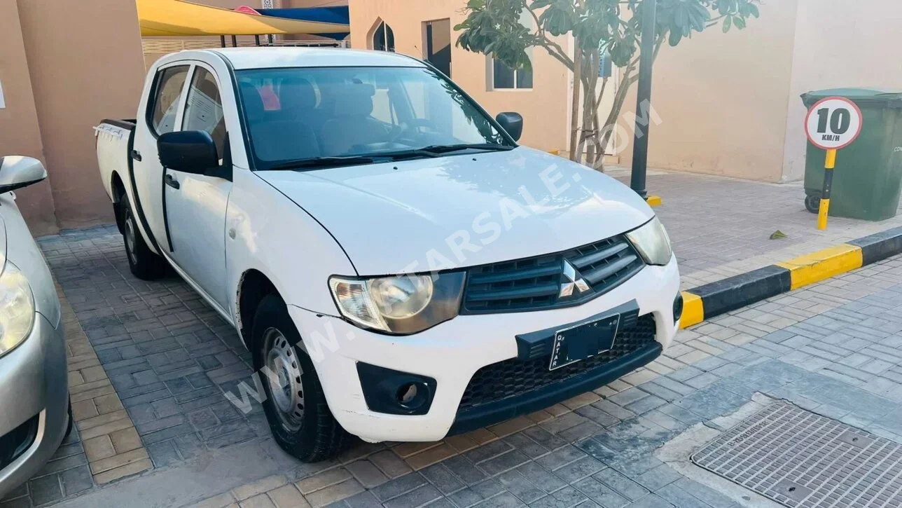 ميتسوبيشي  بيك أب  2015  عادي  396,853 كم  4 سلندر  دفع خلفي  بيكب  أبيض