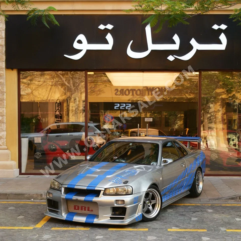 نيسان سكايلاين ار 34 جي تي- ار 2001 عادي 165,100 كم 6 سلندر دفع خلفي سيدان رمادي