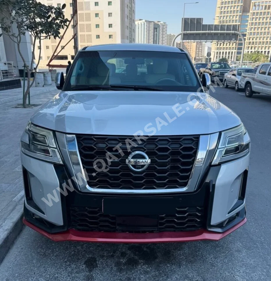 Nissan  Patrol  SE  2013  Automatic  27,000 Km  8 Cylinder  Four Wheel Drive (4WD)  SUV  Brown  With Warranty