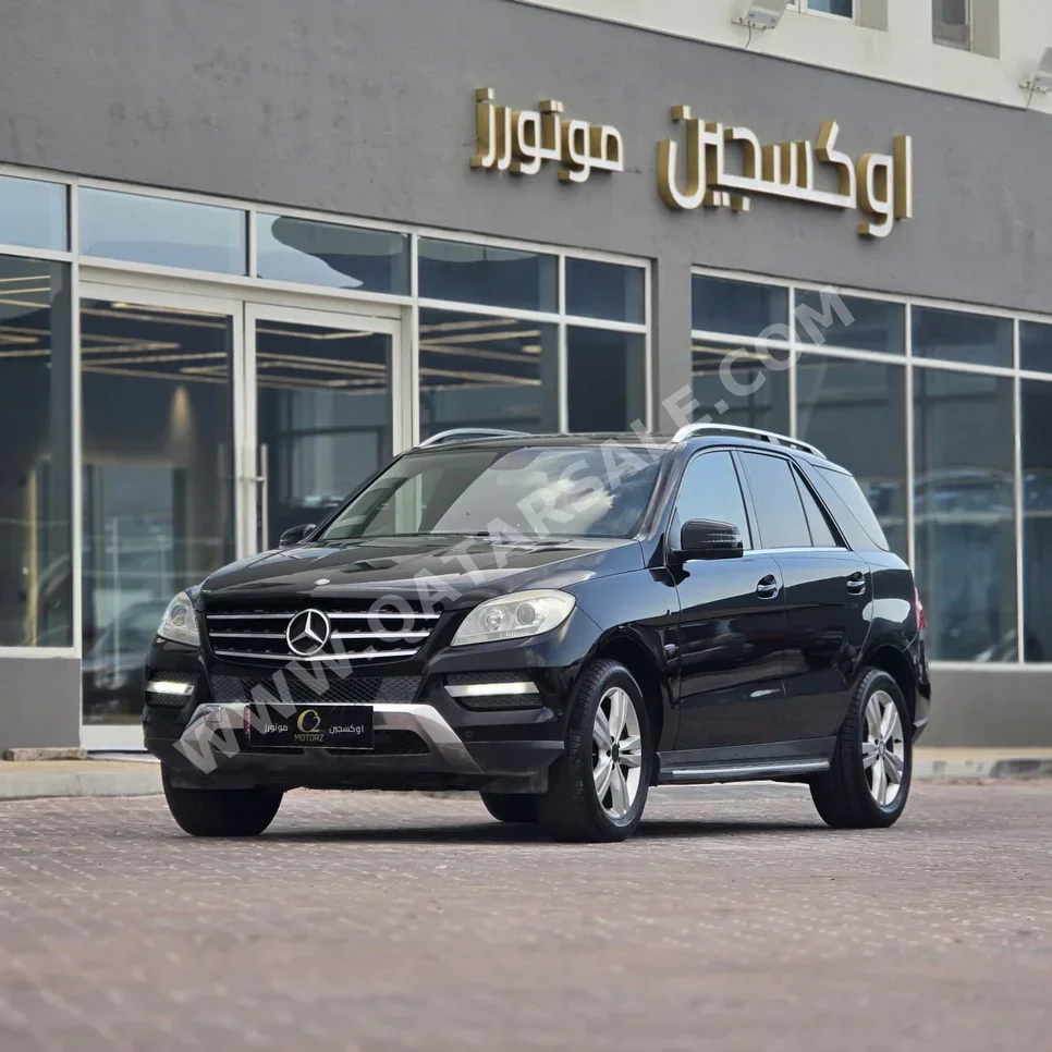 مرسيدس - بنز ام ال 350 2014 اوتوماتيك 186,000 كم 6 سلندر دفع رباعي اس يو في أسود