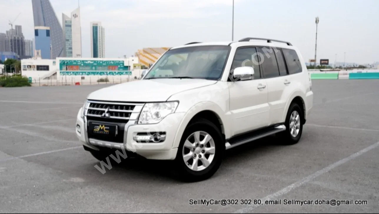 ميتسوبيشي باجيرو 3.5 2016 اوتوماتيك 99,000 كم 6 سلندر دفع رباعي اس يو في أبيض