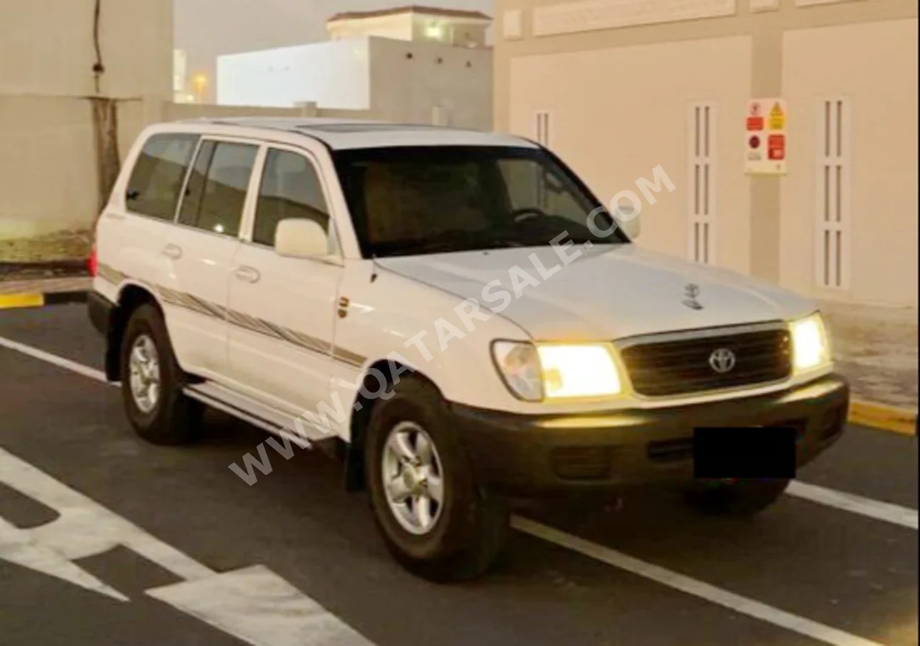 تويوتا  لاند كروزر  جي اكس  2000  عادي  400,000 كم  6 سلندر  دفع رباعي  اس يو في  أبيض
