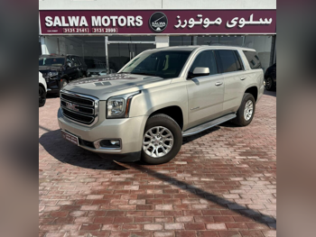 GMC  Yukon  XL  2015  Automatic  208,000 Km  8 Cylinder  Four Wheel Drive (4WD)  SUV  Gold