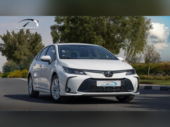 Toyota  Corolla  Hybrid  2025  Automatic  0 Km  4 Cylinder  Front Wheel Drive (FWD)  Sedan  White  With Warranty