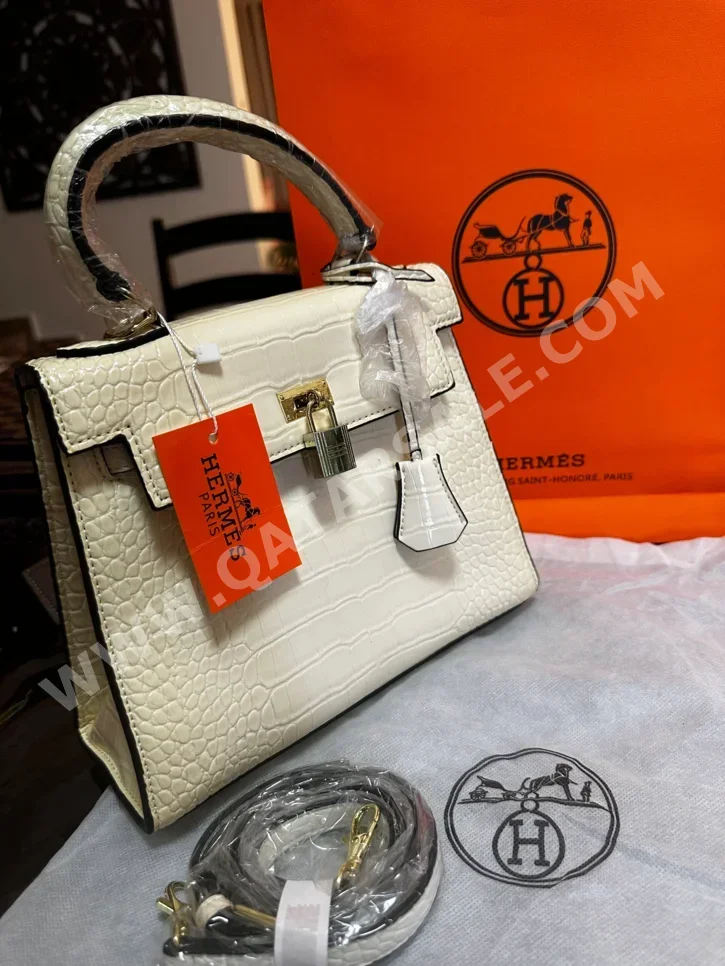 حقائب  - هيرميس  - كريم  - جلد صناعي  - نسائي