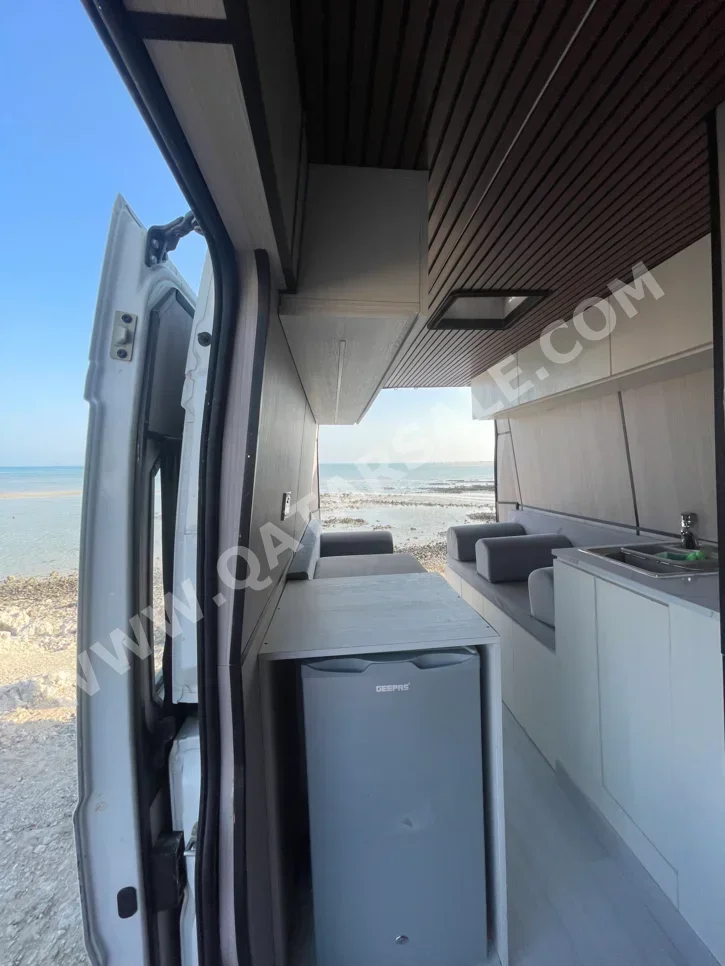 Caravan - 2022  - White  -Made in Qatar  - 48,000 Km