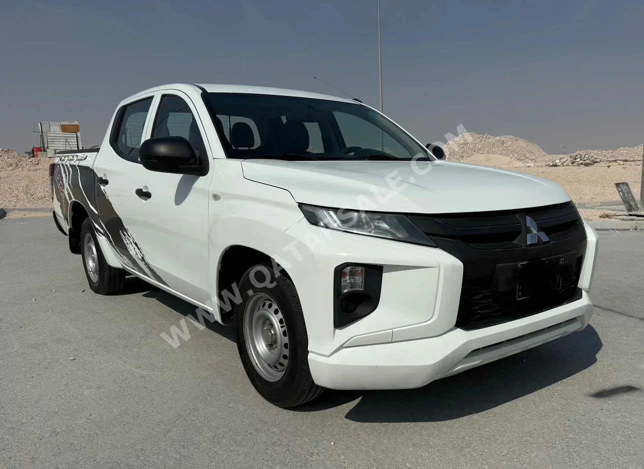 Mitsubishi  L 200  2020  Manual  150,000 Km  4 Cylinder  Rear Wheel Drive (RWD)  Pick Up  White