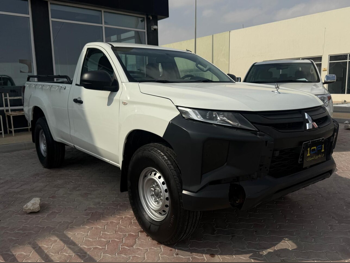 Mitsubishi  Pickup  2023  Manual  56,000 Km  4 Cylinder  Four Wheel Drive (4WD)  Pick Up  White  With Warranty