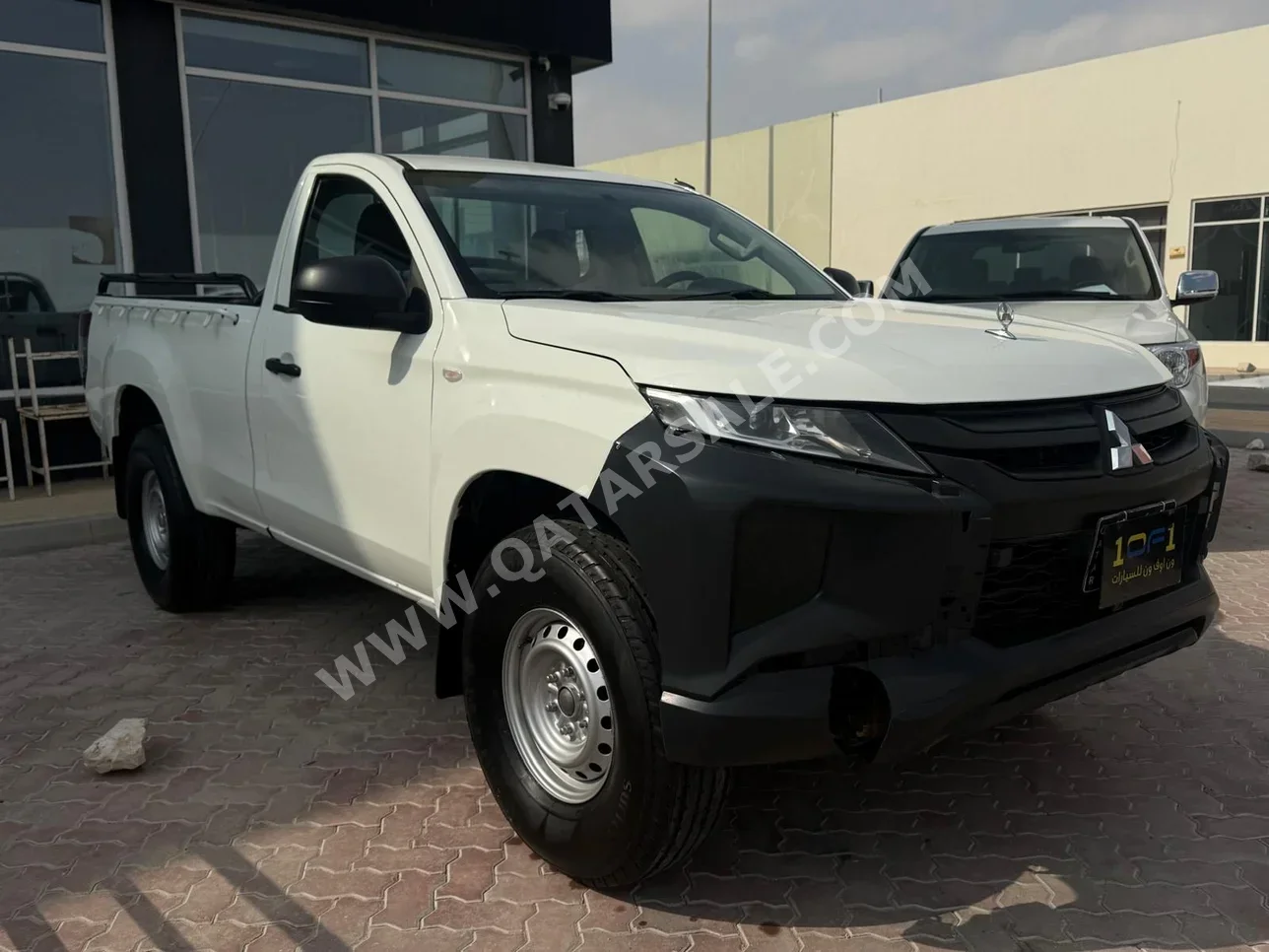 Mitsubishi  Pickup  2023  Manual  56,000 Km  4 Cylinder  Four Wheel Drive (4WD)  Pick Up  White  With Warranty
