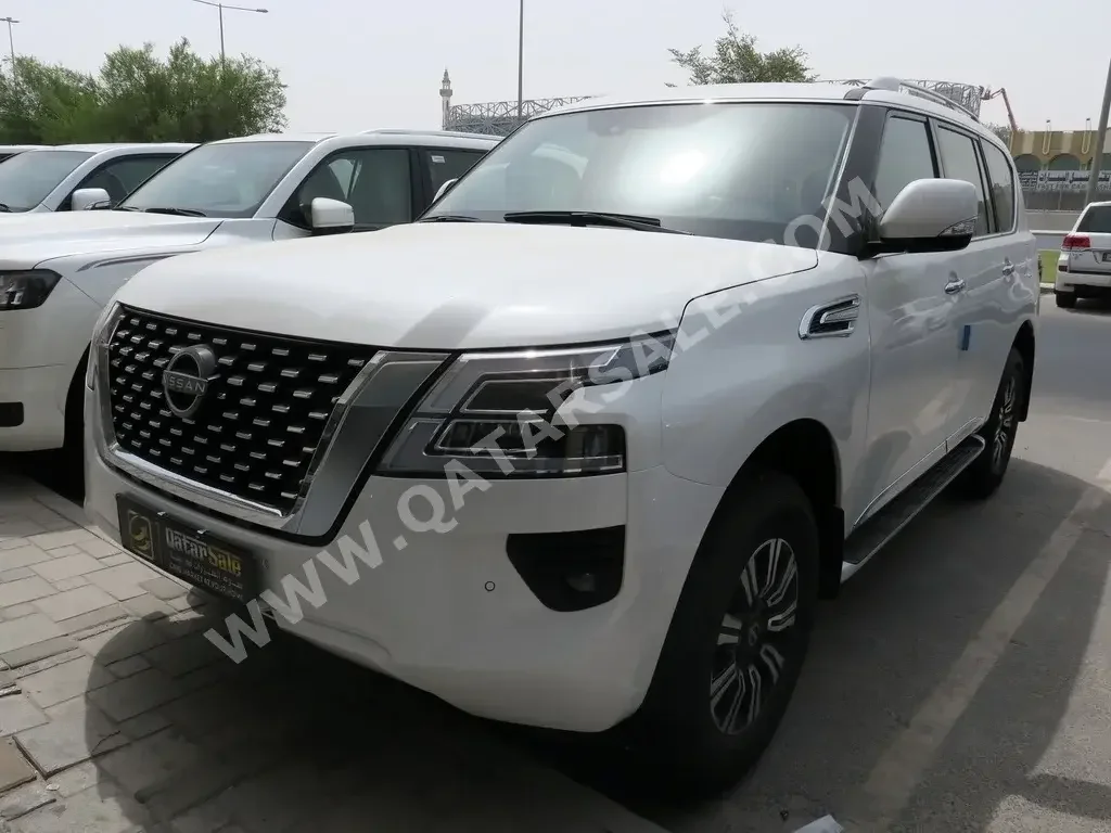 Nissan  Patrol  Titanium  2022  Automatic  0 Km  6 Cylinder  Four Wheel Drive (4WD)  SUV  White  With Warranty