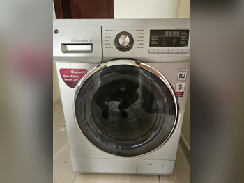 غسالة ملابس & الكل في واحد ال جي \ غسالة تحميل علوي اللون الرمادي