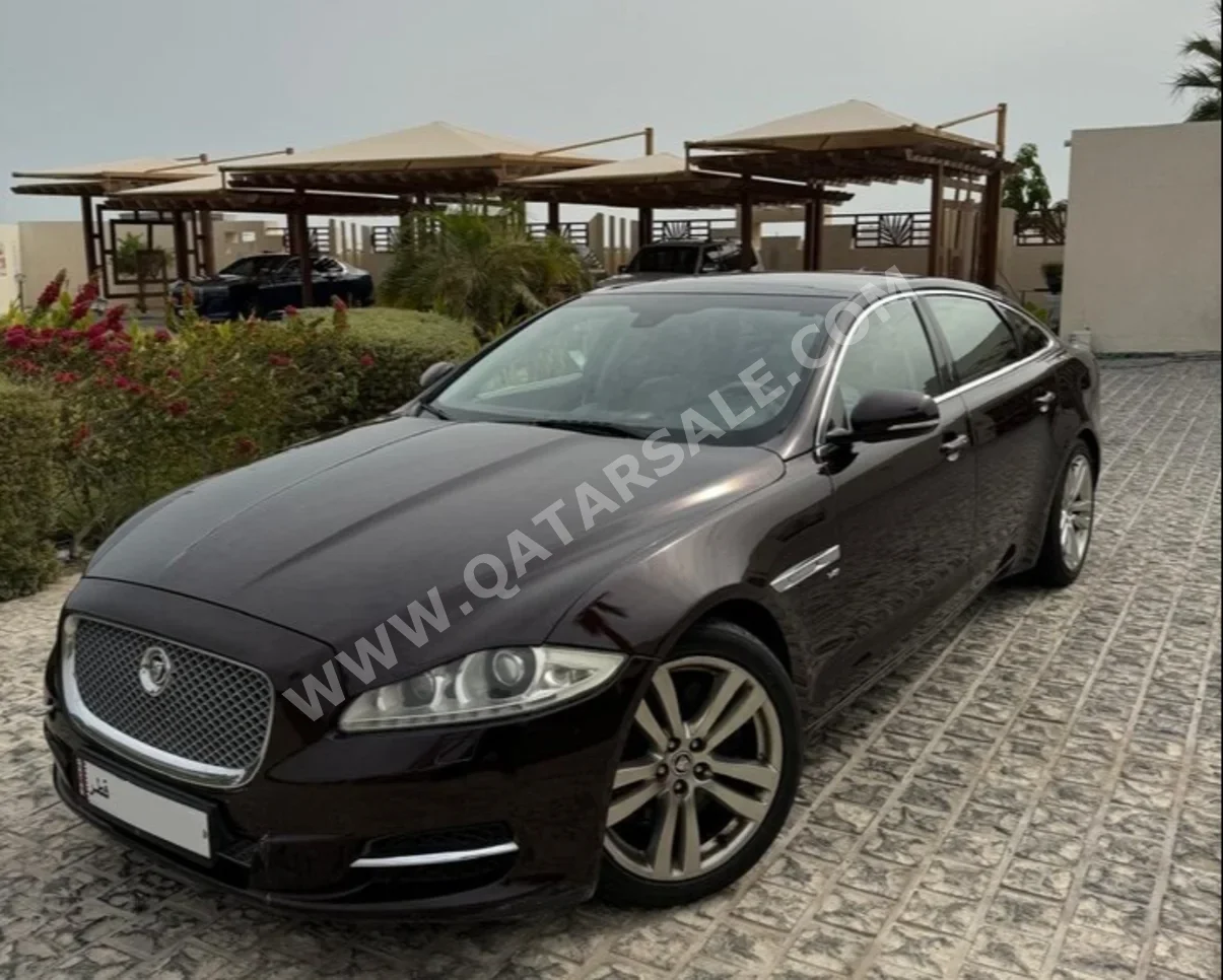 Jaguar  XJL  premium luxury  2013  Automatic  111,066 Km  8 Cylinder  All Wheel Drive (AWD)  Sedan  Black and Beige