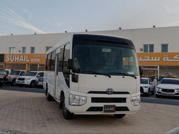 Toyota  Coaster  2019  Manual  144,000 Km  4 Cylinder  Rear Wheel Drive (RWD)  Van / Bus  White