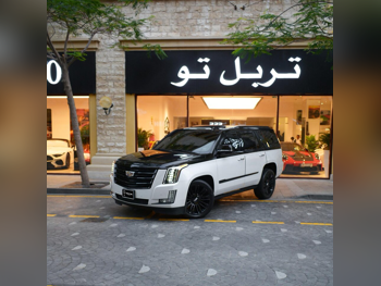 Cadillac  Escalade  Platinum  2016  Automatic  40,300 Km  8 Cylinder  Four Wheel Drive (4WD)  SUV  White and Black