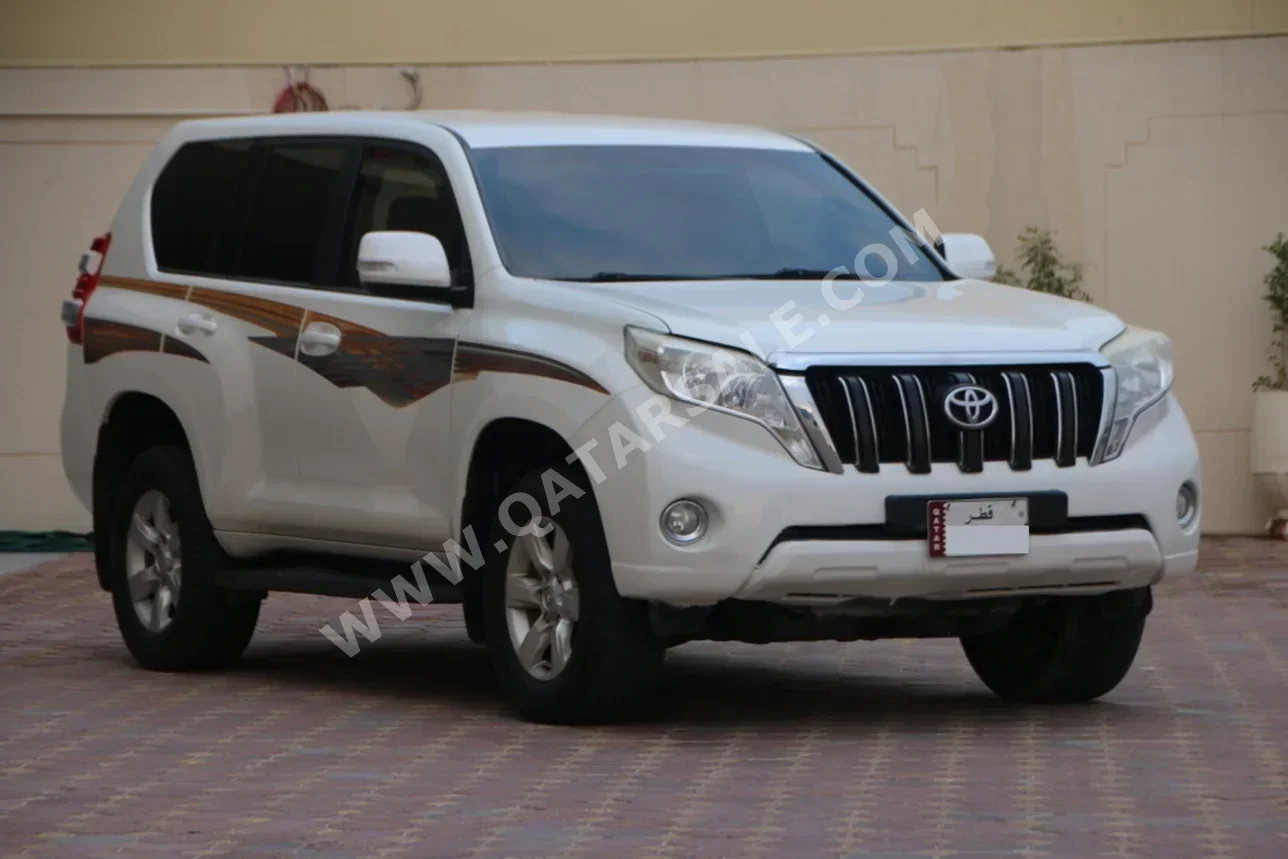 تويوتا  برادو  2015  اوتوماتيك  96,000 كم  4 سلندر  دفع رباعي  اس يو في  أبيض لؤلؤي