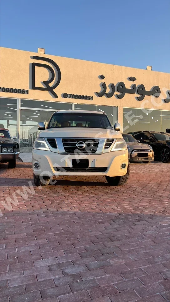 Nissan Patrol Platinum 2015 Automatic 202,000 Km 8 Cylinder Four Wheel Drive (4WD) SUV White
