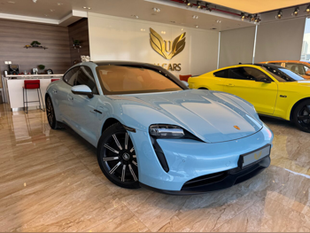 Porsche  Taycan  2021  Tiptronic  18,000 Km  0 Cylinder  Rear Wheel Drive (RWD)  Sedan  Sky Blue  With Warranty