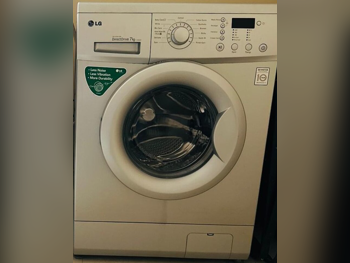 مجموعات الغسالات والمجففات ال جي \  7 كغ  أبيض  2016  غسالة تحميل أمامي  كهرباء
