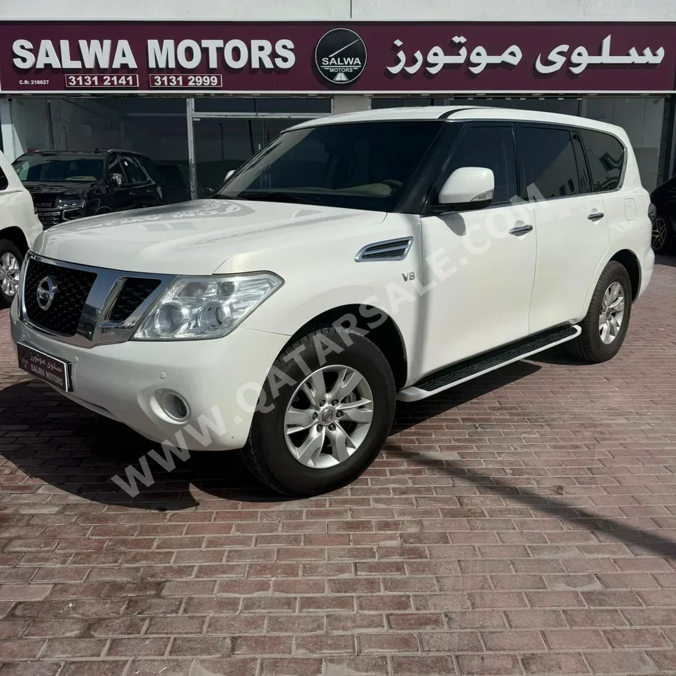 نيسان  باترول  اس اي  2013  اوتوماتيك  275,000 كم  8 سلندر  دفع رباعي  اس يو في  أبيض