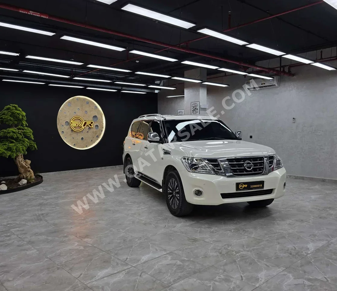 نيسان  باترول  بلاتنيوم  2014  اوتوماتيك  300,000 كم  8 سلندر  دفع رباعي  اس يو في  أبيض