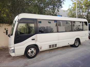 Toyota  Coaster  2019  Manual  152,000 Km  4 Cylinder  Rear Wheel Drive (RWD)  Van / Bus  White