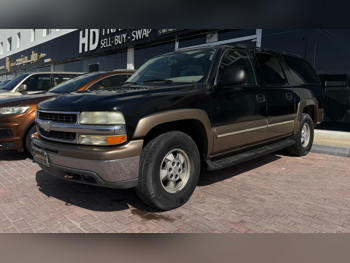 Chevrolet  Suburban  2003  Automatic  110,000 Km  8 Cylinder  Four Wheel Drive (4WD)  SUV  Black and Gold