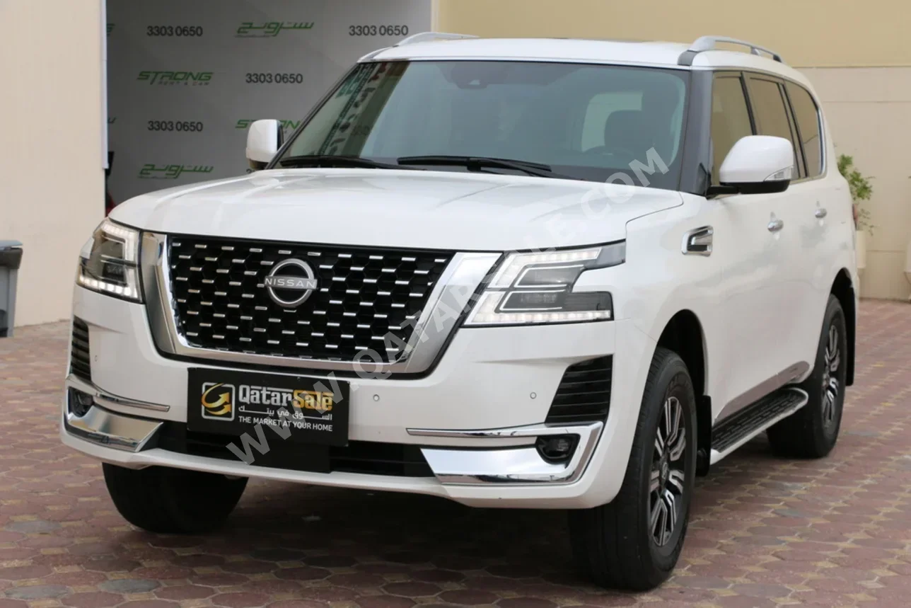 نيسان باترول بلاتنيوم 2023 اوتوماتيك 23,000 كم 6 سلندر دفع رباعي اس يو في أبيض تحت الضمان