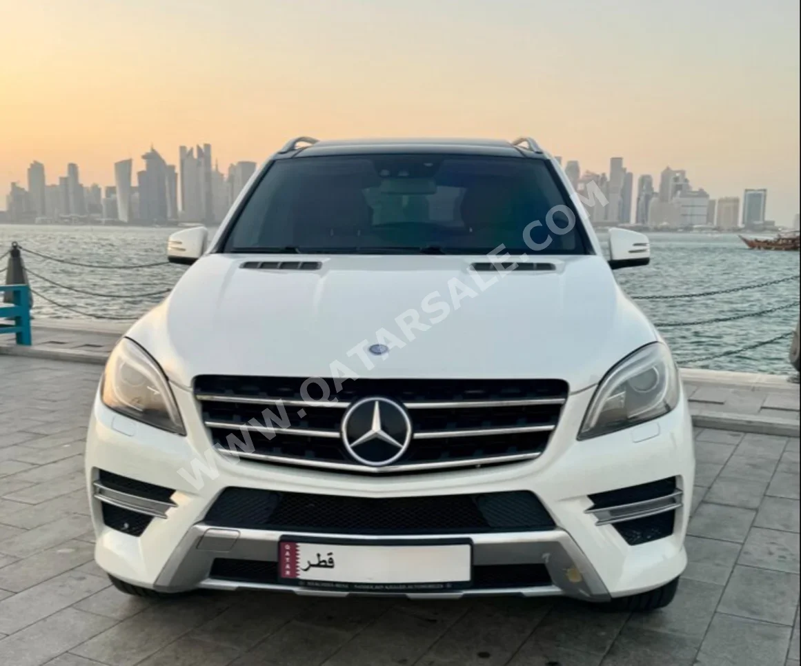 مرسيدس - بنز ام ال 500 AMG 2013 اوتوماتيك 172,000 كم 8 سلندر دفع كلي مستمر اس يو في أبيض تحت الضمان