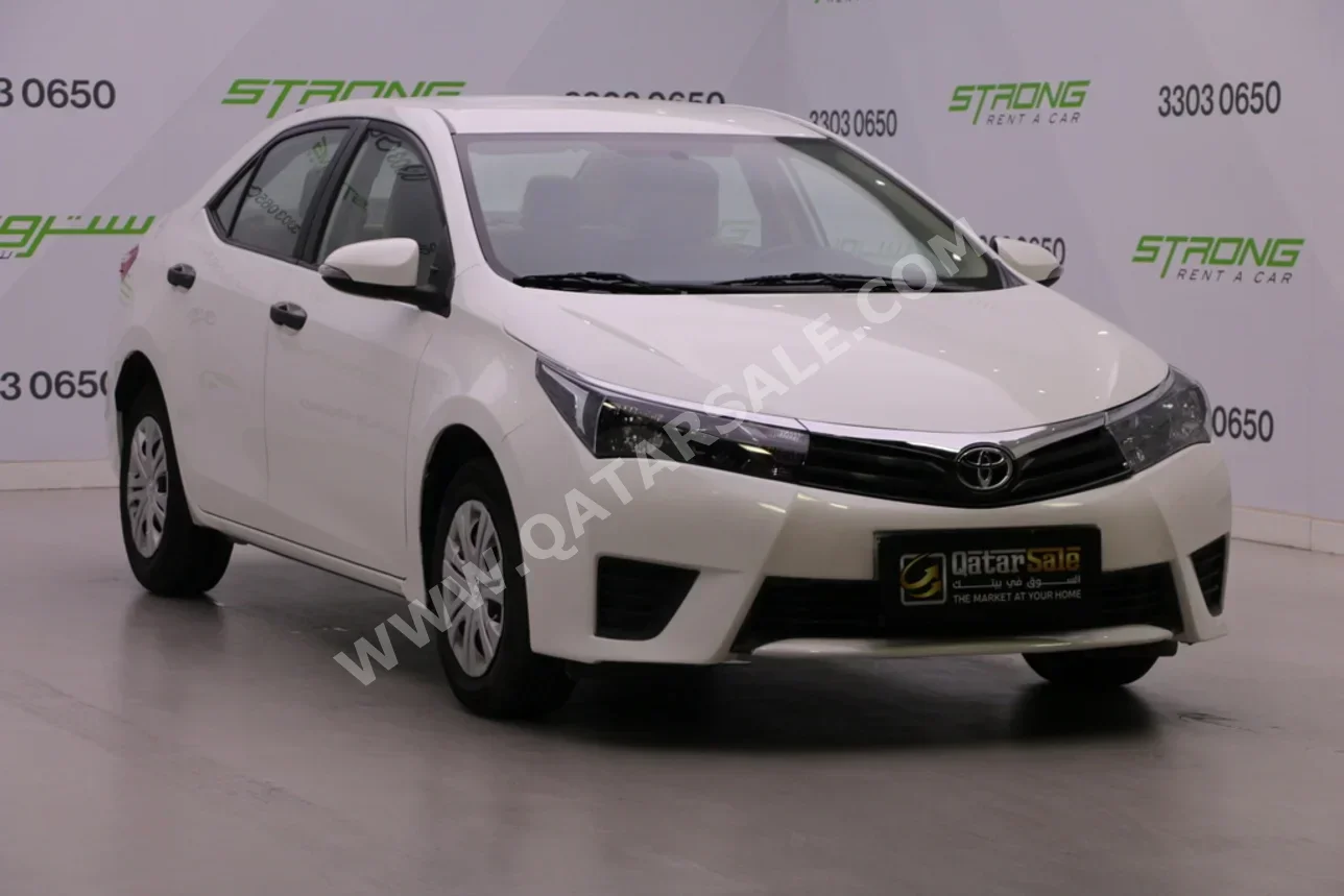Toyota  Corolla  2014  Automatic  97,000 Km  4 Cylinder  Front Wheel Drive (FWD)  Sedan  White